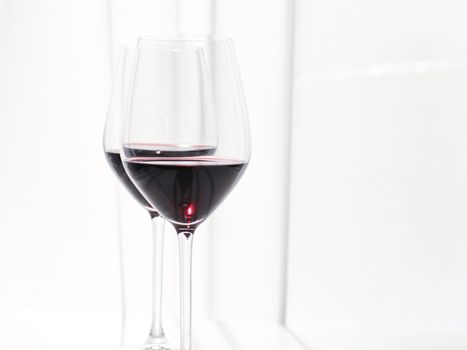 Two crystal glasses of red wine, organic beverage product