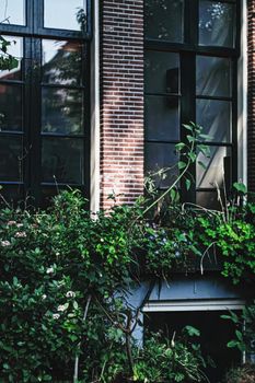 Architectural detail of a building on the main city center street of Amsterdam in Netherlands, european architecture