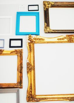 Empty art frames on gallery wall, decor and design details