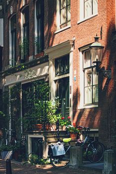 Main downtown street in the city center of Amsterdam in Netherlands on sunny day