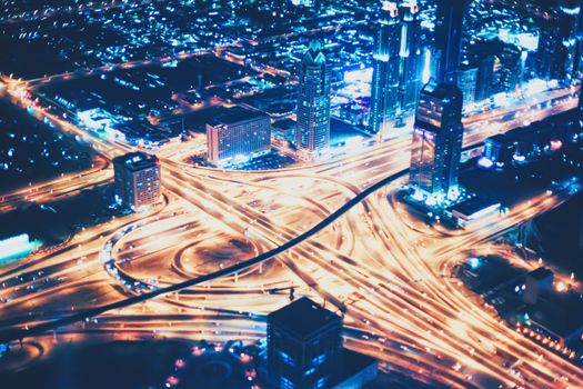 Aerial night view of Dubai in United Arab Emirates, metropolitan cityscape scenery