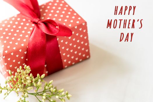 Happy mother's day concept. Gift box and flower