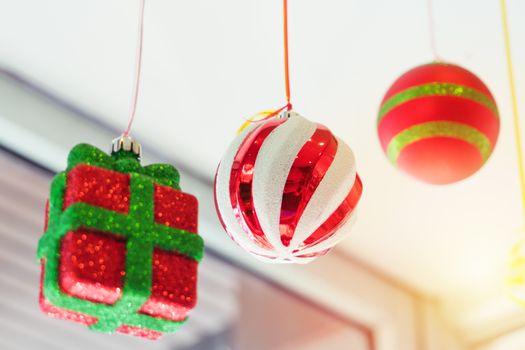 colorful ball and gift box mobile hanging on the ceiling