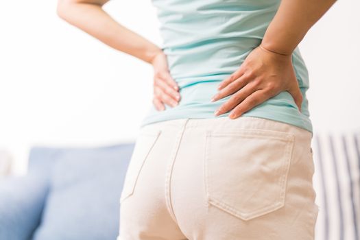 back pain at home. women suffer from backache. healthcare and medical concept