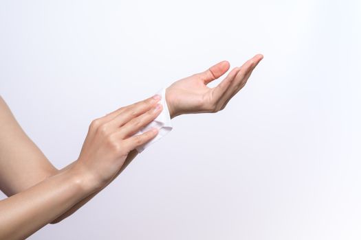 Woman cleaning her hands with white soft tissue paper. isolated on a white backgrounds