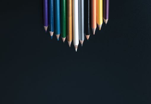 Leadership business concept. white color pencil lead other color on black background