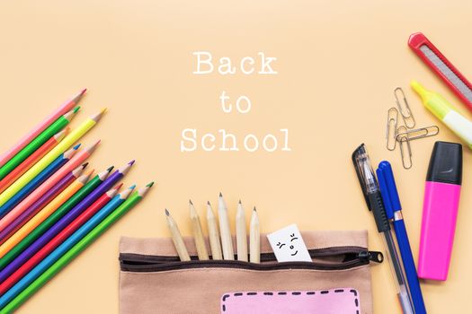 Welcome back to school background, colorful color pencil and stationery bag on yellow backgrounds with copy space