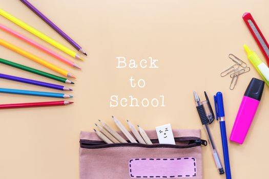 Welcome back to school background, colorful color pencil and stationery bag on yellow backgrounds with copy space