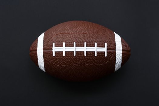 American football isolated on black background . Sport object concept