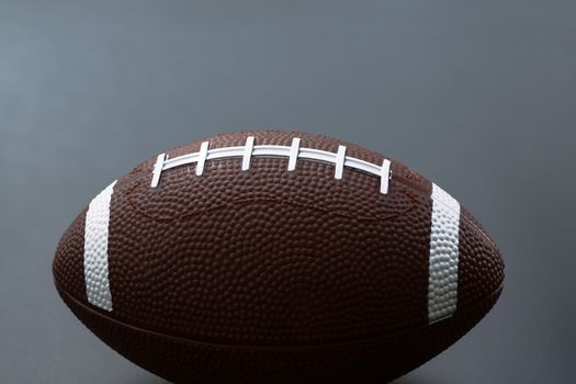 American football isolated on black background . Sport object concept