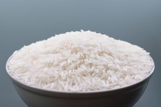 bowl of jasmine white rice on black backgrounds