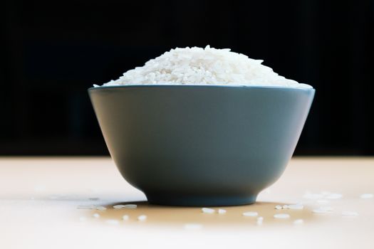 bowl of jasmine white rice on yellow backgrounds