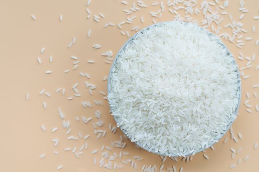 bowl of jasmine white rice on yellow backgrounds