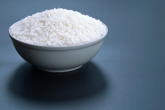 bowl of jasmine white rice on black backgrounds