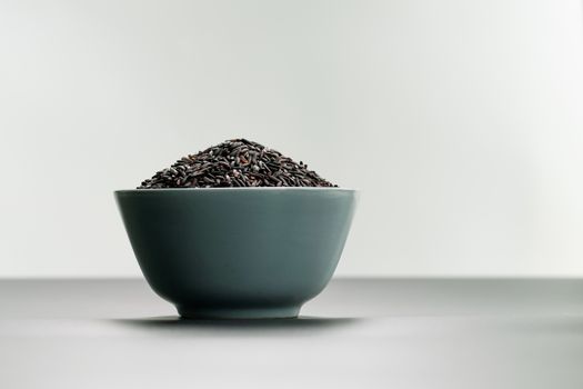 bowl of jasmine black rice on white backgrounds