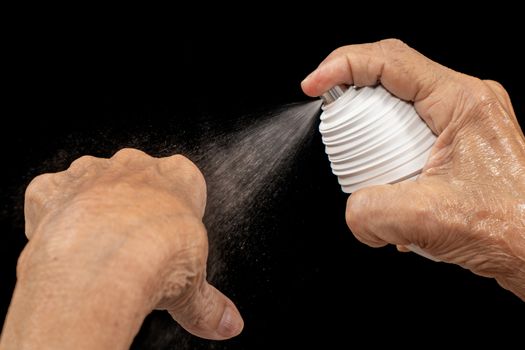 Spray, Pulverized fluid getting out from a container withstood by a human hand