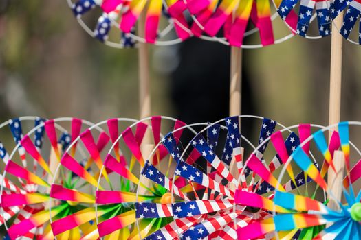 Close up the rainbow pinwheel toy, colorful turbines toy