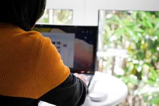 Student women is working on laptop computer