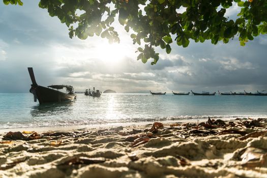 long tailed boat, fishing boat, motor boat with the sunrays