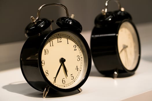 the alarm vintage clocks face on the table
