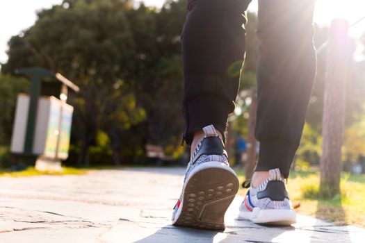 Shanghai China, November 3, 2017 : close up of man shoe while walking in the park, walk for life concept