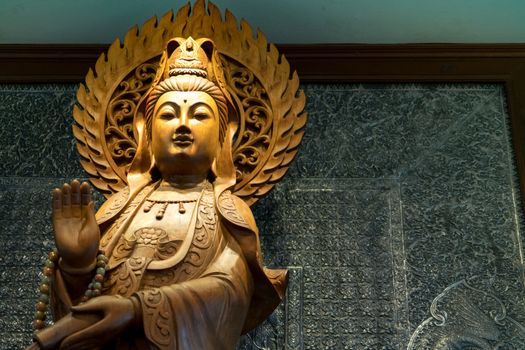 the engrave of gold wooden Guan Yin