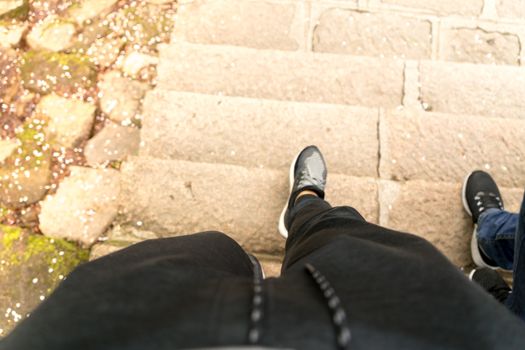 the soft focus of the young man leg is stepping down on the staircase