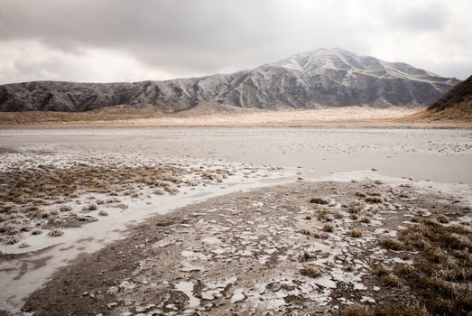 Mount Aso and Kusasenri in winter. covered by golden yellow grassland - Kumamoto, Japan