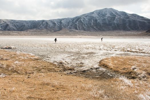 Mount Aso and Kusasenri in winter. covered by golden yellow grassland - Kumamoto, Japan