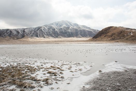 Mount Aso and Kusasenri in winter. covered by golden yellow grassland - Kumamoto, Japan