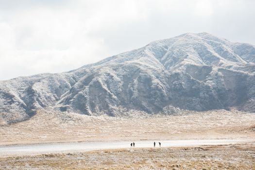 Mount Aso and Kusasenri in winter. covered by golden yellow grassland - Kumamoto, Japan