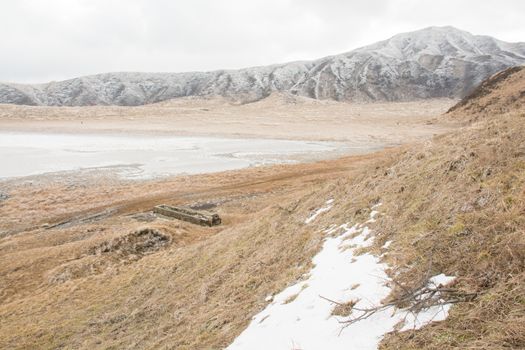 Mount Aso and Kusasenri in winter. covered by golden yellow grassland - Kumamoto, Japan