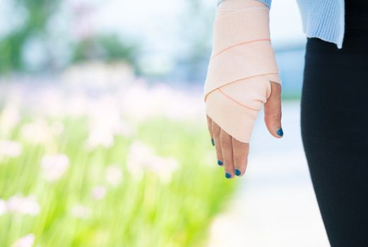 arm splint, Injured female hand with lower body. Hand bandage with elastic fabric