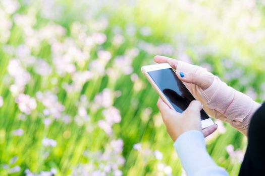 young student women shopping online on smartphone while wrist hand pain. business and modern lifestyle concept