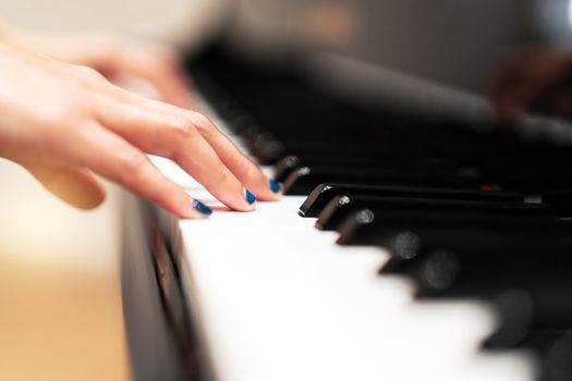 women hand on classic Piano keyboard closeup, music instruments concept