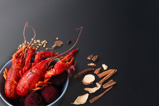 Crayfish red, Baby Lobster with herb for stir fry on black background