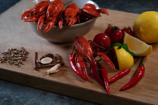 Crayfish or baby Lobster. Red boiled crawfishes on a wooden