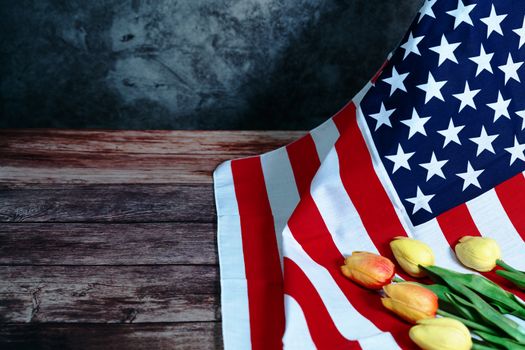 Memorial Day with American flag and flower on wooden background