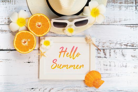 Beautiful summer holiday, Beach accessories, ornage, sunglasses, hat and shells on wooden backgrounds