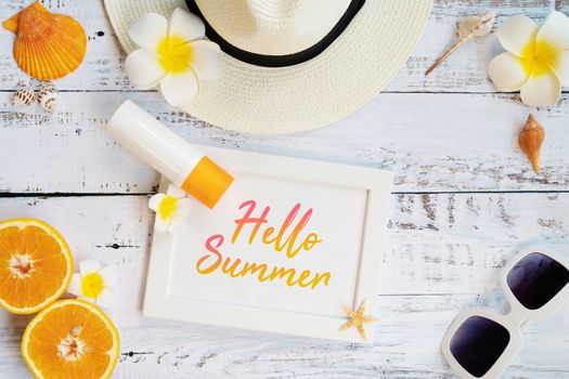 Beautiful summer holiday, Beach accessories, ornage, sunglasses, hat and shells on wooden backgrounds