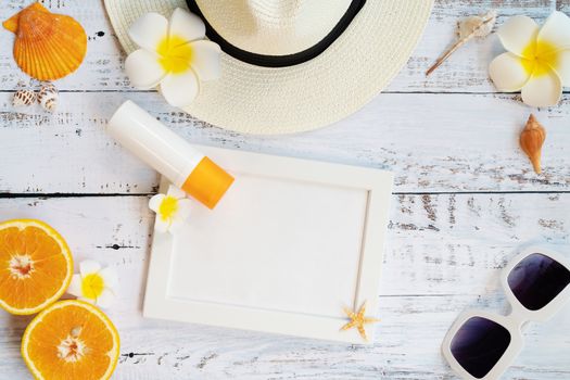 Beautiful summer holiday, Beach accessories, orange, sunglasses, hat and shells on wooden backgrounds