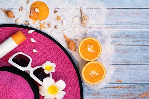 Beautiful summer holiday, Beach accessories, sunglasses, hat and shells on wooden backgrounds