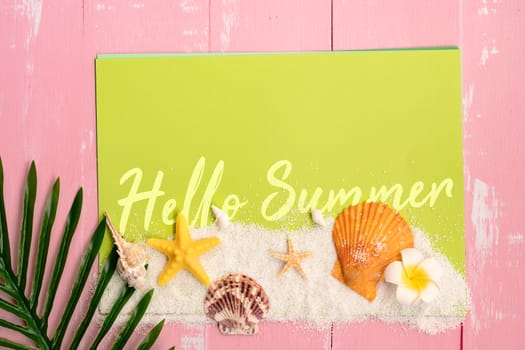 Beautiful summer holiday, Beach accessories, sea shells, sand and palm leave on paper for copy space