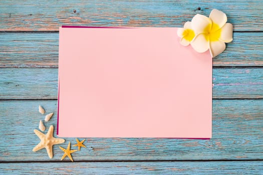 Beautiful summer holiday, Beach accessories, seashells and flower on paper for copy space