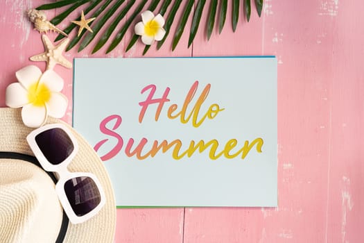 Beautiful summer holiday, Beach accessories, sea shells, hat, sunglasses and palm leave on paper for copy space