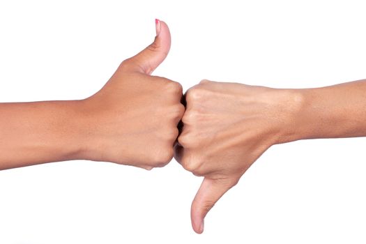 Female hands making signals with the thumb of one hand up and the other hand down