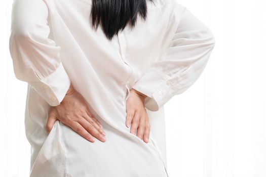 back pain at home. women suffer from backache. healthcare and medical concept