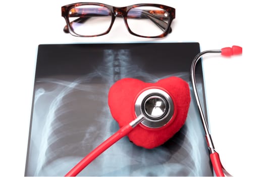 world health day healthcare and medicine red stethoscope and red heart symbol on x-ray film healthy and insurance concept - isolated