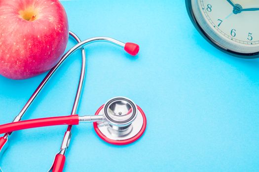 world health day healthcare and medicine stethoscope and red apple healthy and insurance concept