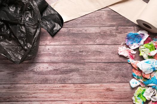 garbage of dirty paper and sanitary hygiene paper on wooden background composition healthcare concept
